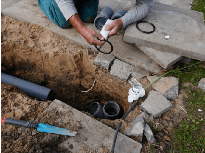 people working on sewer line